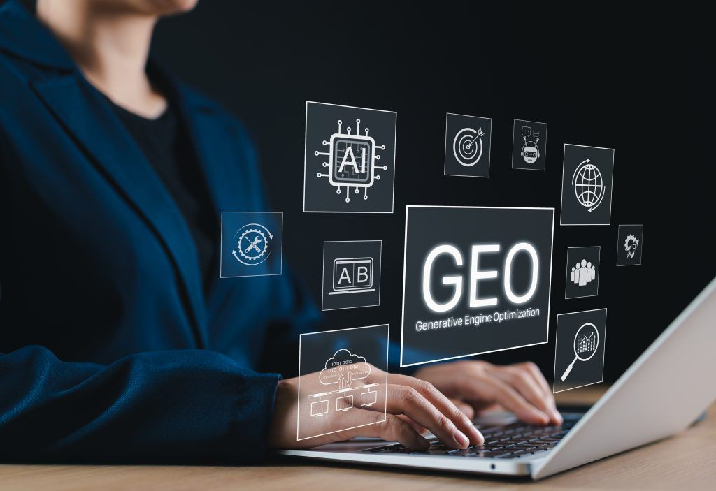 Professional woman using laptop with GEO (Generative Engine Optimization) icons displayed.